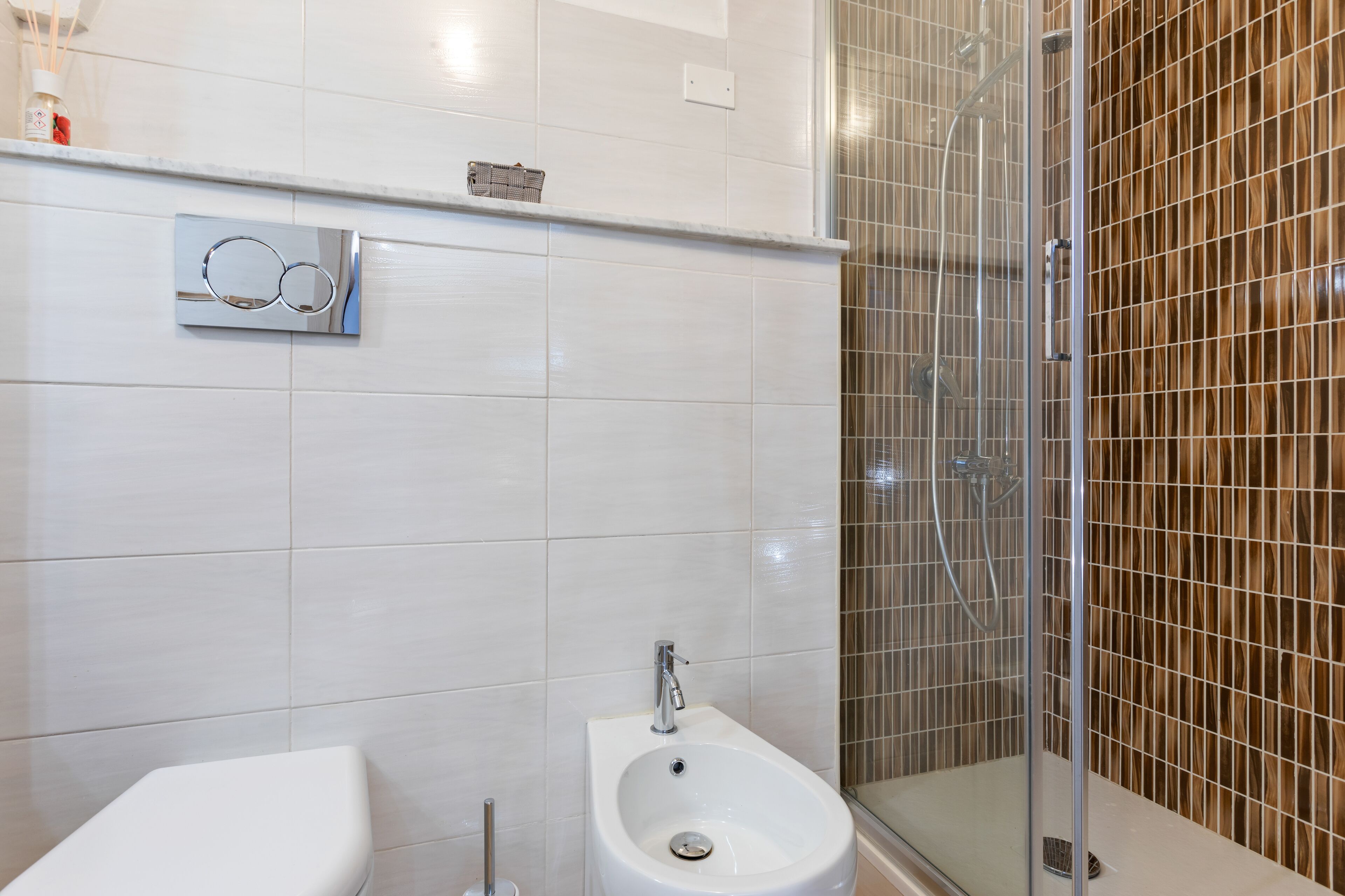 Studio | Bathroom | Shower, rainfall showerhead, hair dryer, bidet