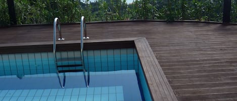 Seasonal outdoor pool, pool loungers