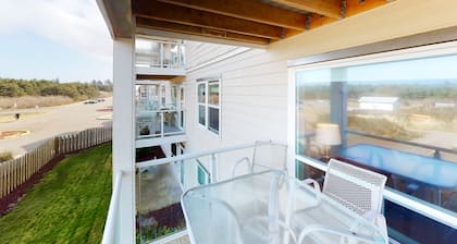 Open & airy condo w/ private balcony, jetty view, & quick access to the beach
