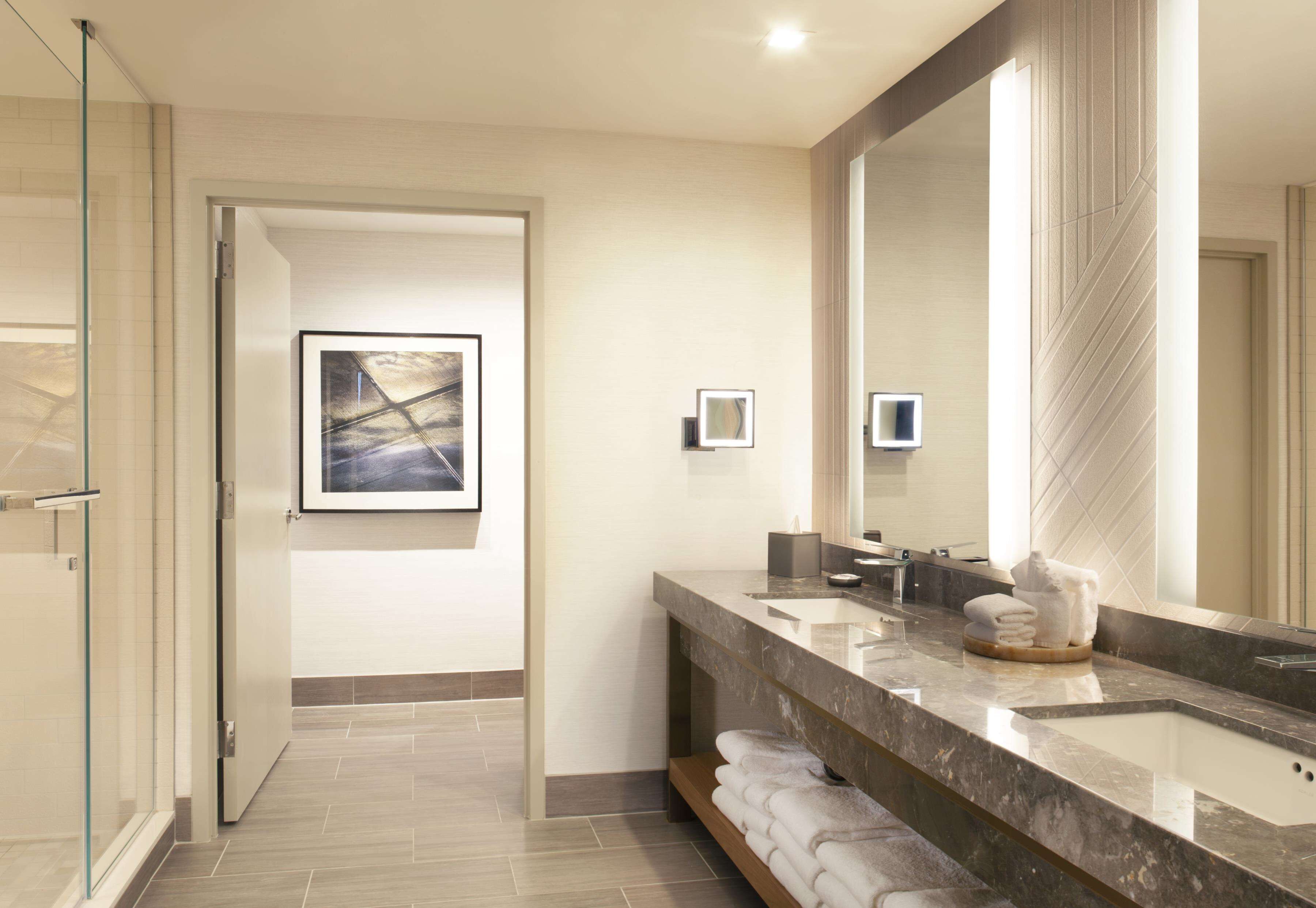 designer toiletries, hair dryer, towels