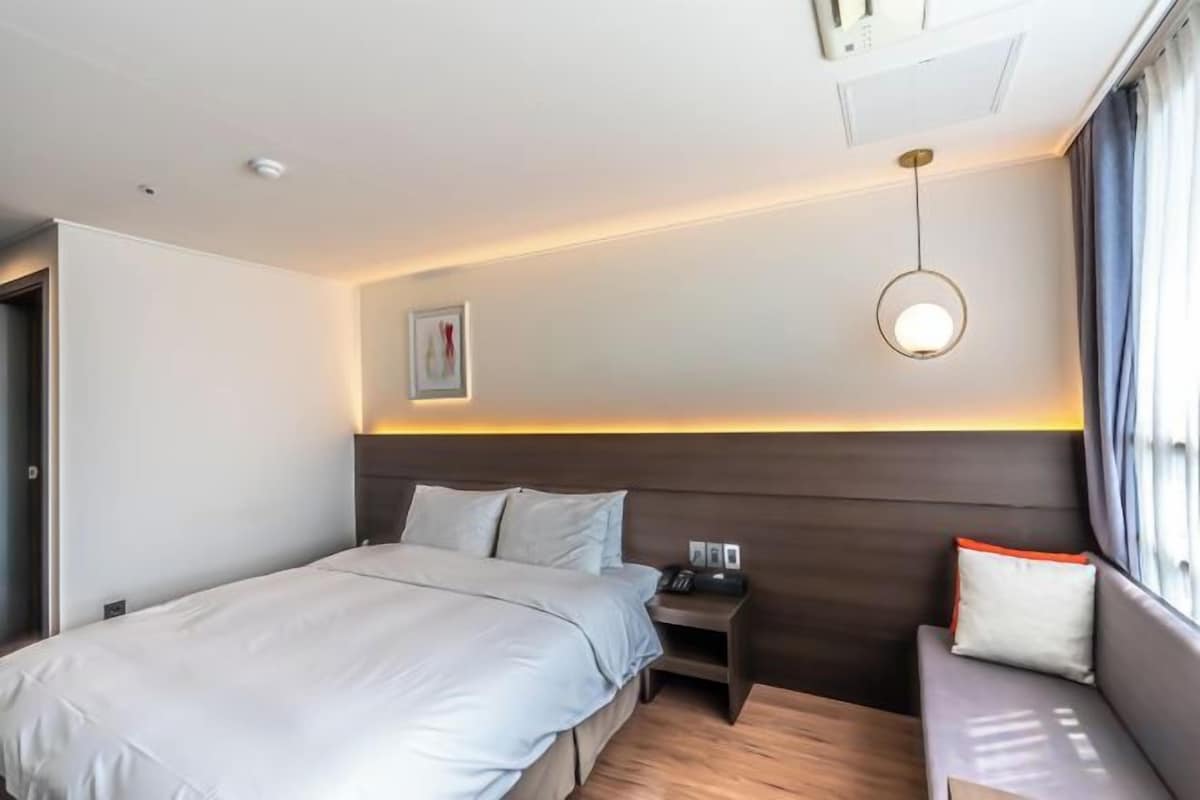 Premium bedding, down duvets, memory-foam beds, in-room safe