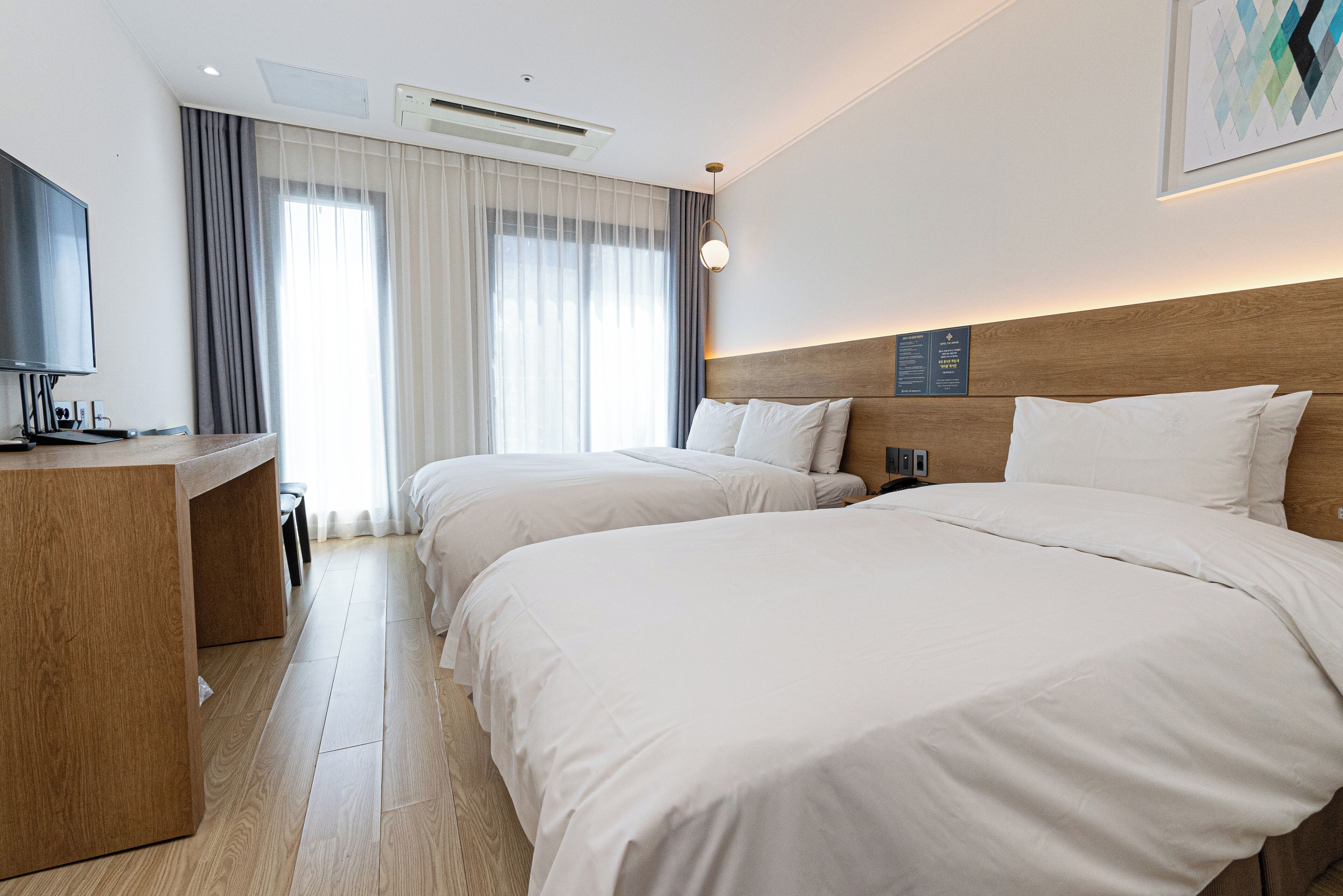 terrace family twin | premium bedding, down duvets, memory-foam beds, in-room safe