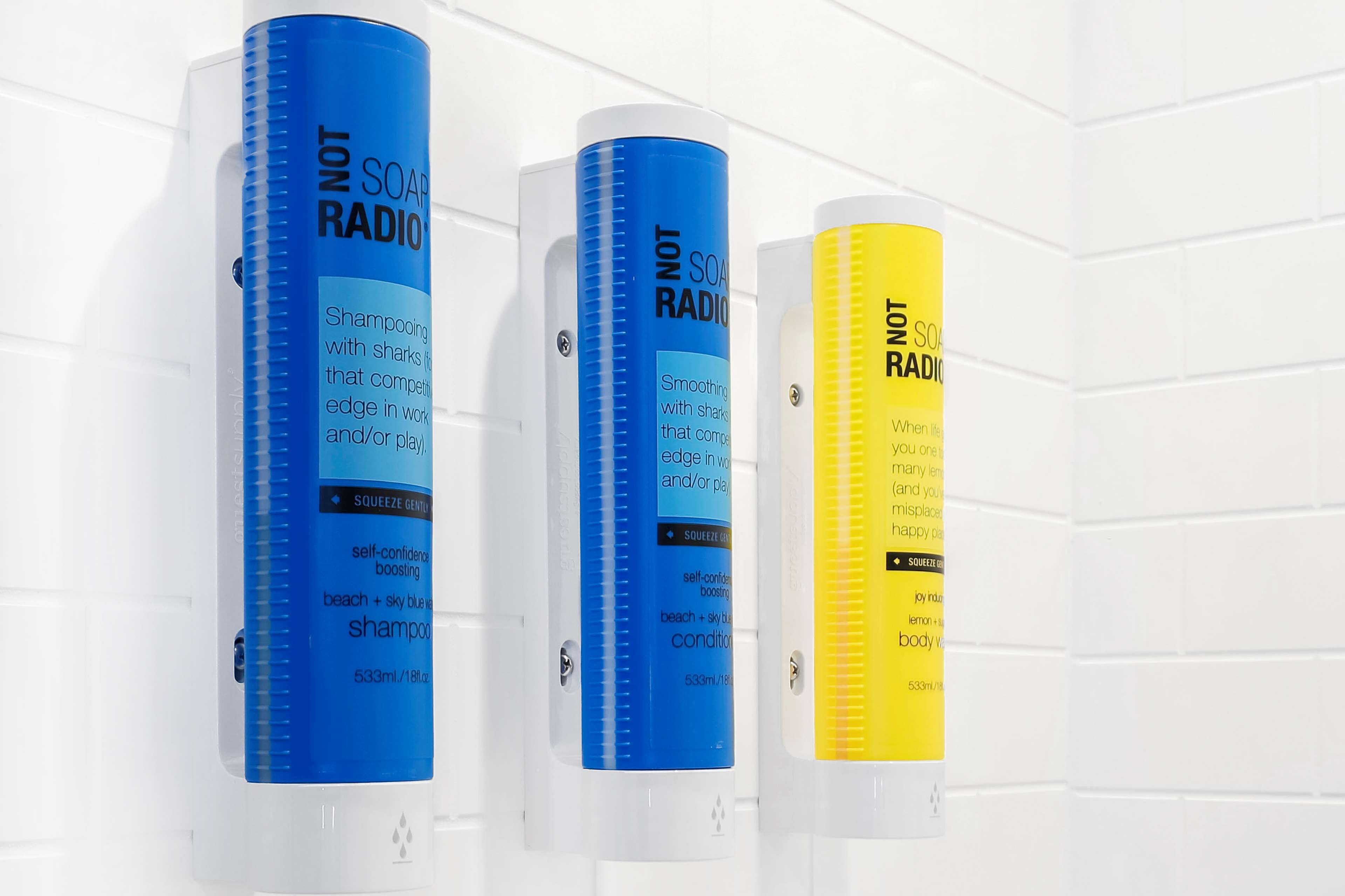 Three shampoo bottles labeled 'NOT SOAP RADIO' in different colors.