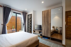 Apartemen Grand | Minibar, meja kerja, tirai kedap cahaya, dan Wi-Fi gratis