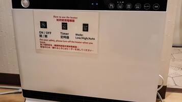 A white electric heater with a control panel featuring ON/OFF, Timer, and Mode (Low/High/Auto) settings.