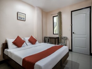 A hotel room with a bed, a desk, a chair, a window with curtains, and a door. - Super OYO 604 Chateau Cinco Dormitel - Hostel (Davao)