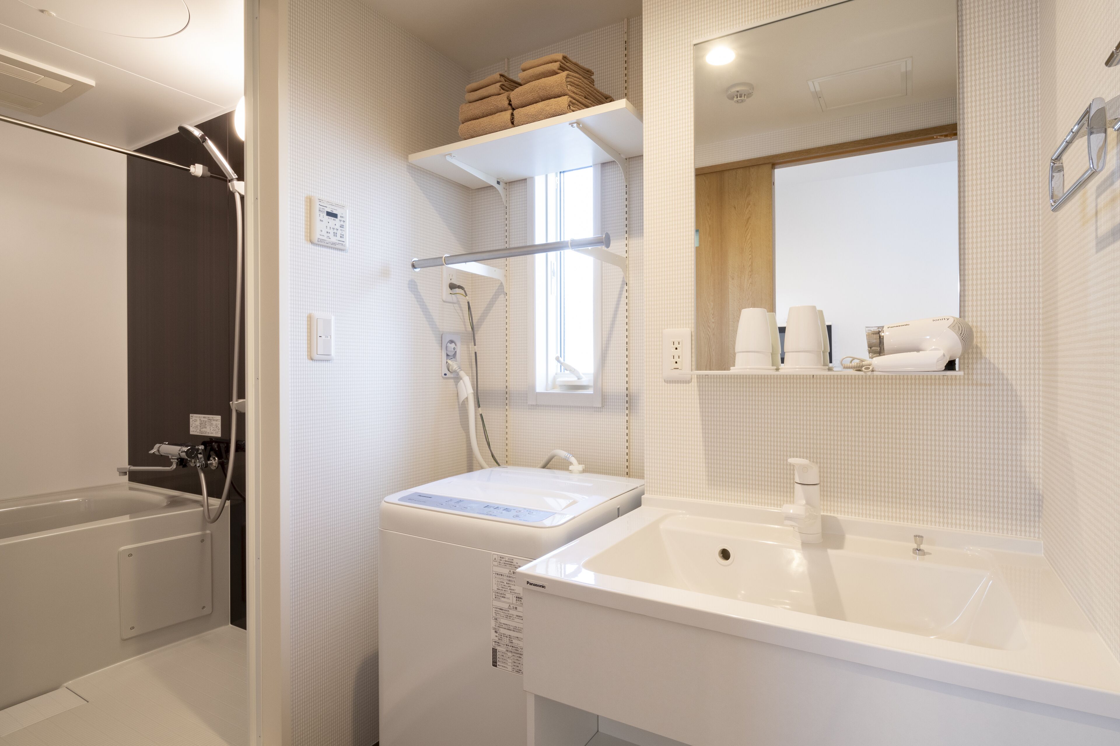 deluxe quadruple room | bathroom | separate bathtub and shower, free toiletries, hair dryer, slippers