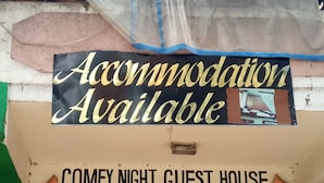 A sign for a guest house with a message "Accommodation Available" and "COMFY NIGHT GUEST HOUSE". - Comfy Night Guest House (Nakuru)