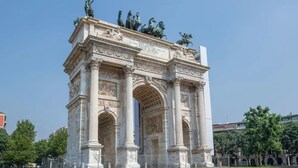 A large, ornate monument with classical architecture, featuring columns and statues on top. - Sweett | Sempione I - One Bedroom Apartment, Sleeps 2 (Milano)