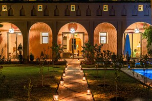 Luxury Villa | Living room | 32-inch flat-screen TV with satellite channels, TV, fireplace