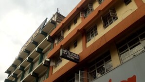 A hotel building with a sign indicating self-contained rooms. - Hotel Joska (Nakuru)