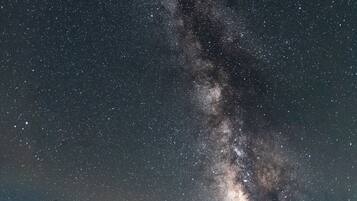 A night sky filled with stars and the Milky Way.