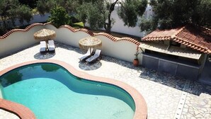 Seasonal outdoor pool, open 9:00 AM to 7:00 PM, pool umbrellas