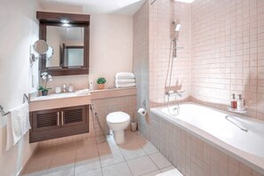 A modern bathroom with a toilet, sink, and bathtub. - Elite Royal Apartment - Burj Khalifa & Fountain view - Crystal (Dubai)