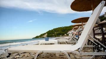 On the beach, white sand, rowing