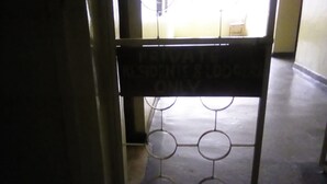 A private entrance sign with a metal gate. - Pekers Lodge (Nakuru)