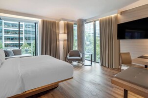 Premium bedding, desk, laptop workspace, iron/ironing board