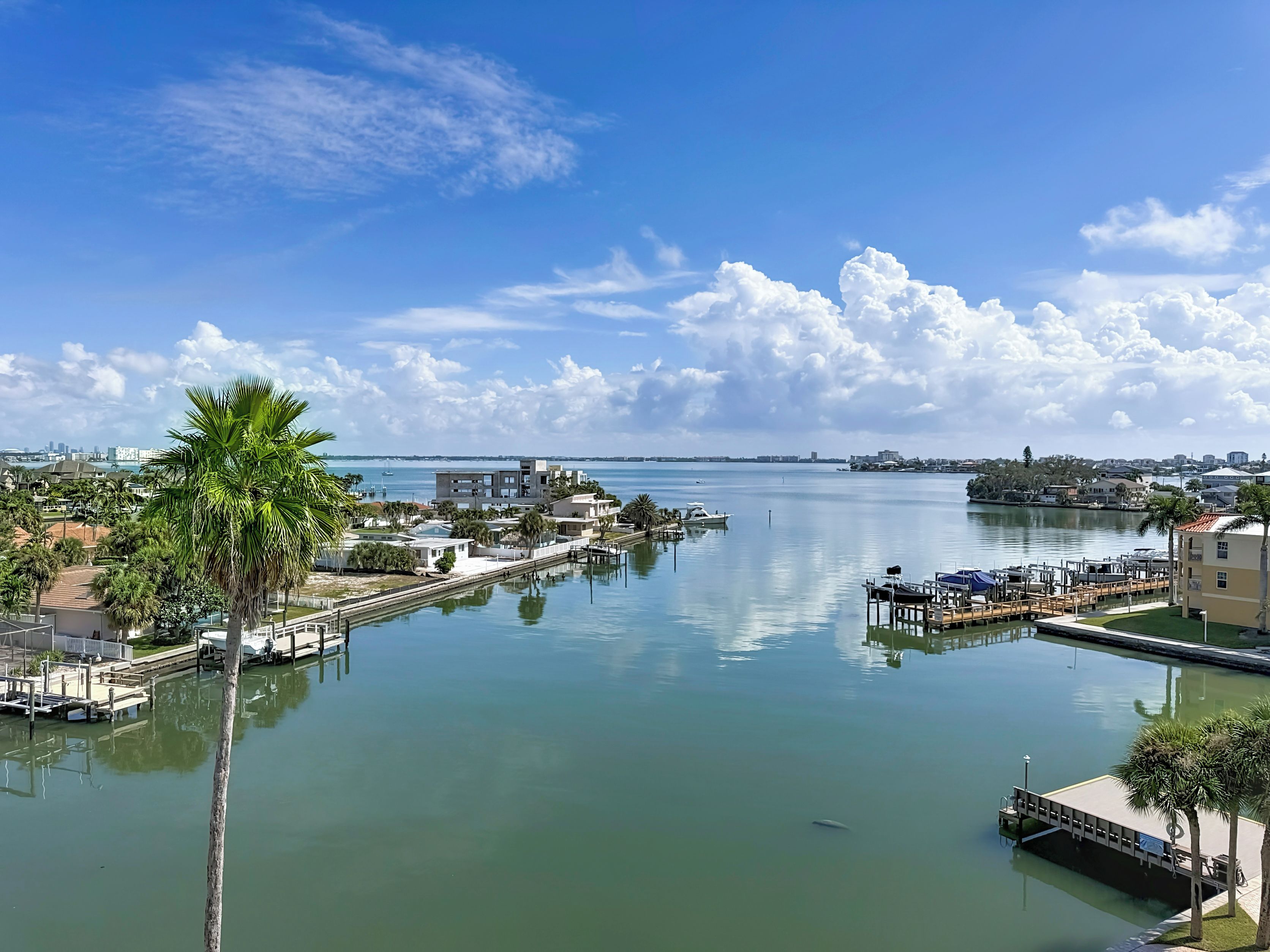 A marina with docks, boats, and a clear view of the water.