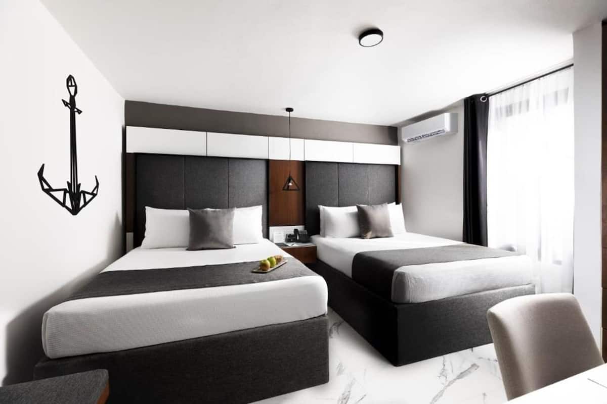 Premium bedding, down comforters, memory foam beds, in-room safe