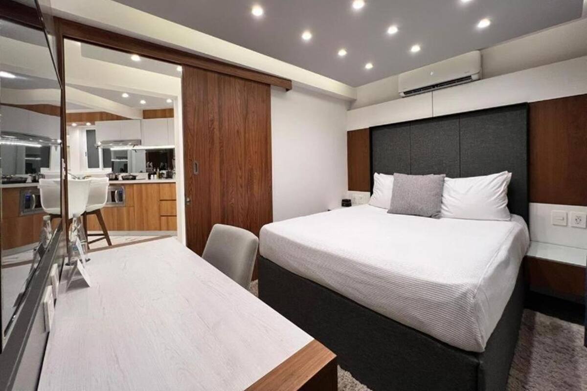 Luxury 4 bedroom Kitchen & Living Room | Premium bedding, down comforters, memory foam beds, in-room safe