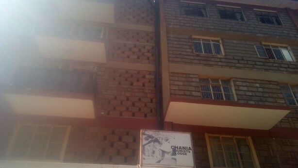 A multi-story building with a sign for 'CHANIA TOURISTS LODGE'. - Chania Guest House (Mai Mahiu)