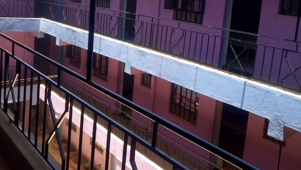 A multi-story building with balconies and railings. - Esidai Hotel (Mai Mahiu)