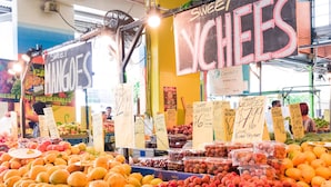 A fruit and vegetable market with various produce on display and price tags visible. - Oaks Cairns Hotel (Cairns)