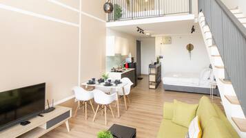 Comfort Duplex, 1 Bedroom | Living area | Flat-screen TV