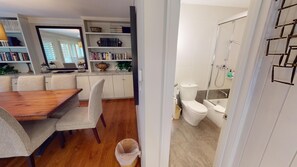Enjoy a well-organized space with a dining area, kitchen, and bathroom featuring a bathtub and shower.