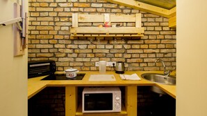 Apartment (Split Level) | Private kitchen | Full-sized fridge, microwave, stovetop, cookware/dishes/utensils - Butterfly Dream Apartment (Budapest)