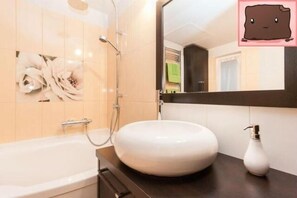 Bathtub, hair dryer, towels