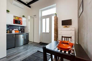Studio Apartment | Private kitchenette | Full-size fridge, microwave, stovetop, cookware/dishes/utensils - Downtown Studio Apartment (Budapest)