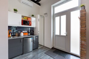 Studio Apartment | Private kitchen | Full-size fridge, microwave, stovetop, cookware/dishes/utensils - Downtown Studio Apartment (Budapest)
