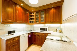 Apartment | Private kitchen | Full-size fridge, microwave, oven, stovetop - Apartment Kiraly (Budapest)