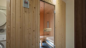 A sauna room with wooden walls and a bench. - Detached Bungalow with Washing Machine near Lake (Dahlem)