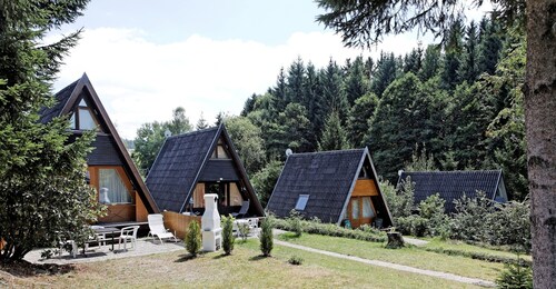Wooden Chalet with Terrace near Swimming Lake