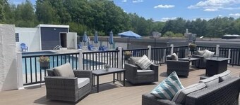 Inviting condo in quiet locale with partial lake views, balcony & grilling area