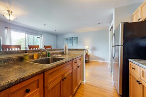 Fridge, microwave, oven, stovetop - Inviting condo in quiet locale with partial lake views, balcony & grilling area (Gilford)