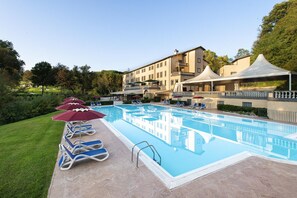 Indoor pool, outdoor pool, pool umbrellas, sun loungers
