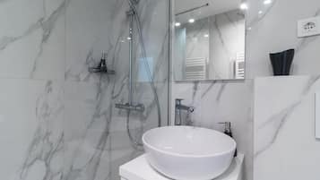 Apartment, 2 Bedrooms | Bathroom | Hair dryer, slippers, towels, toilet paper