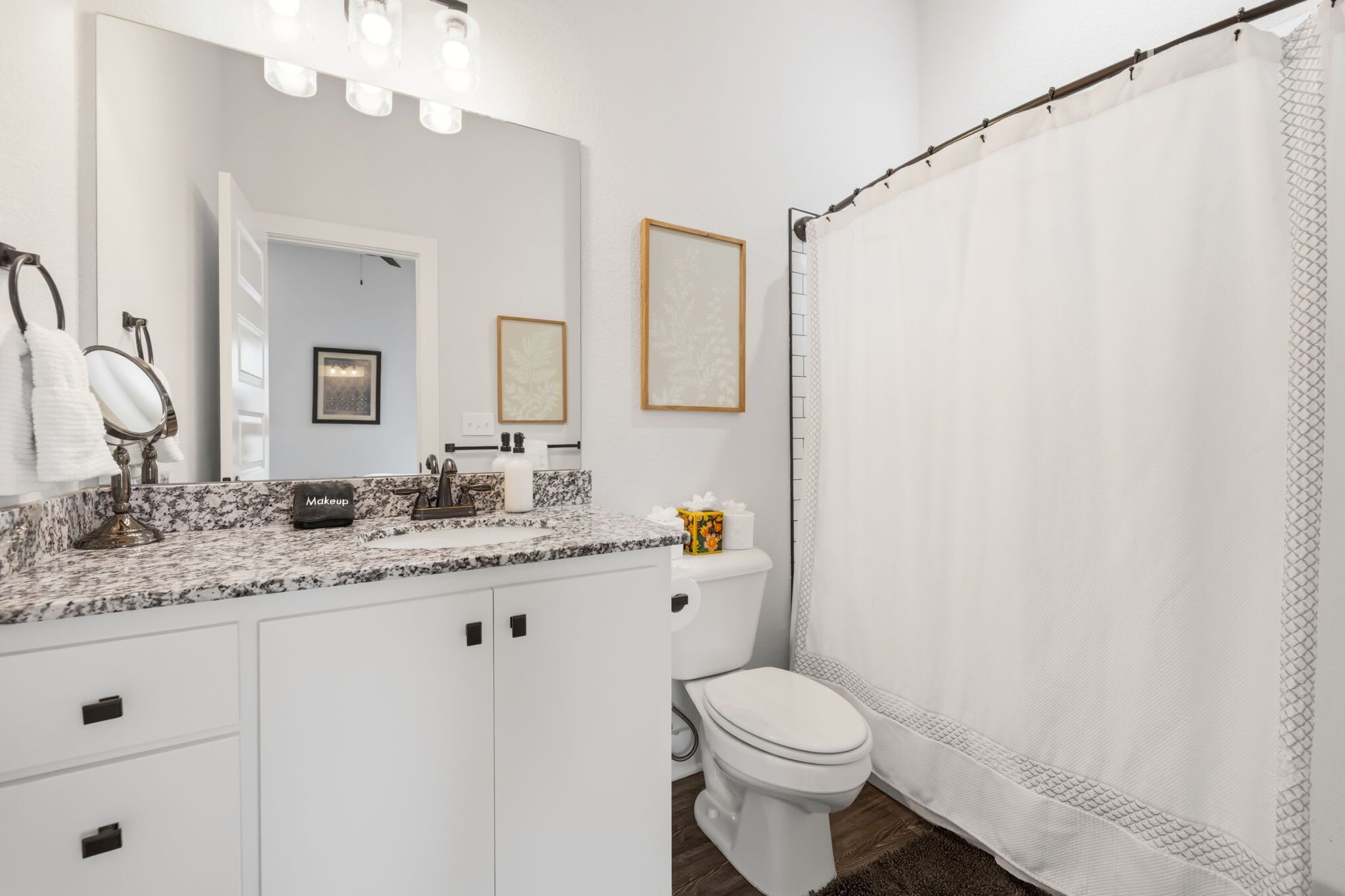 Bathtub, hair dryer, towels, shampoo