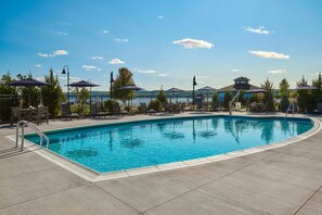 Outdoor pool, open 7:00 AM to 10:00 AM, pool umbrellas, pool loungers