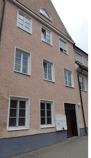 Traditional architecture with evenly spaced windows and a symmetrical facade.