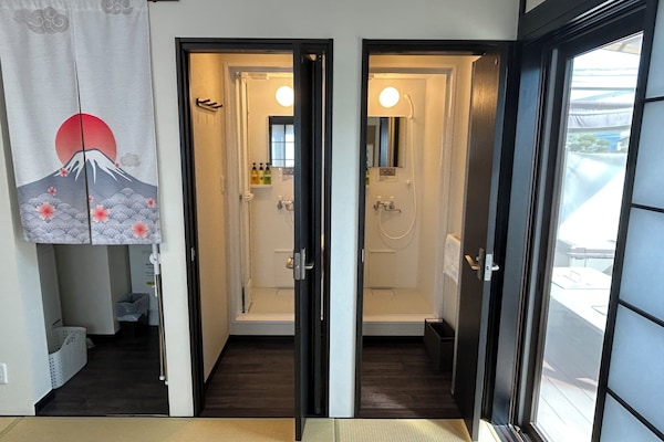 Shower, free toiletries, hair dryer, slippers