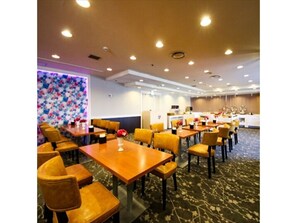 Enjoy meals in the dining area with a table and chairs.