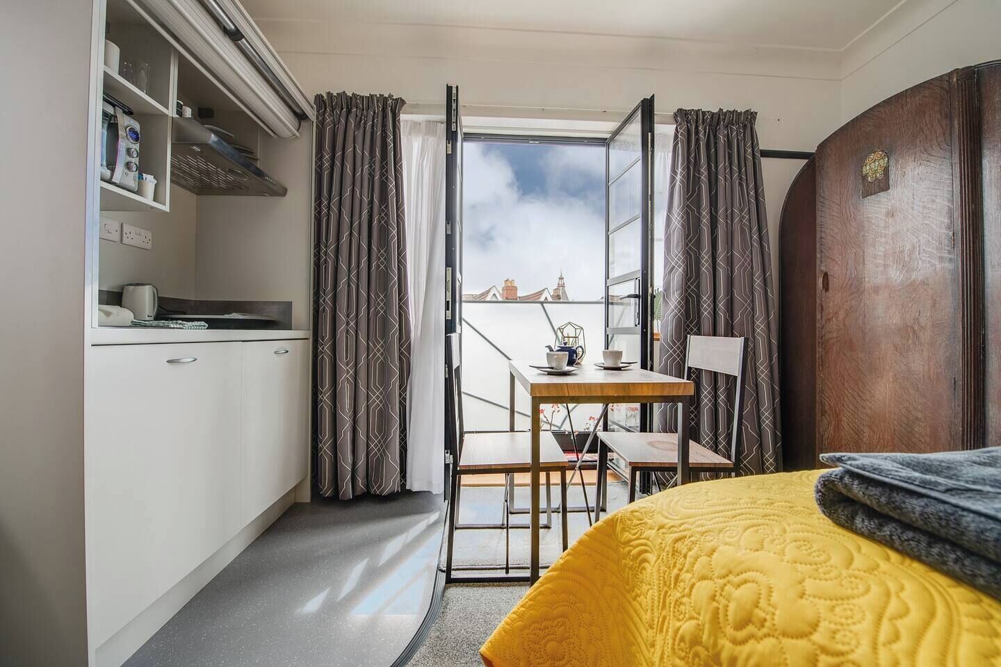 1 bedroom, desk, iron/ironing board, travel crib