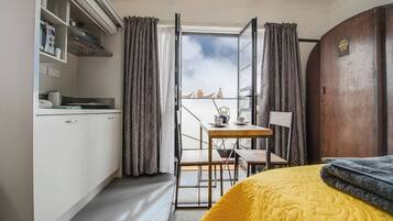 1 bedroom, desk, iron/ironing board, travel crib