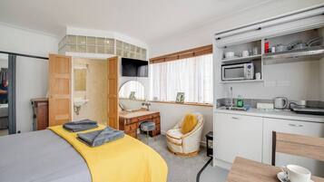 1 bedroom, desk, iron/ironing board, travel crib