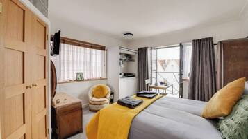 1 bedroom, desk, iron/ironing board, travel crib