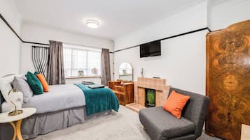 1 bedroom, desk, iron/ironing board, travel cot